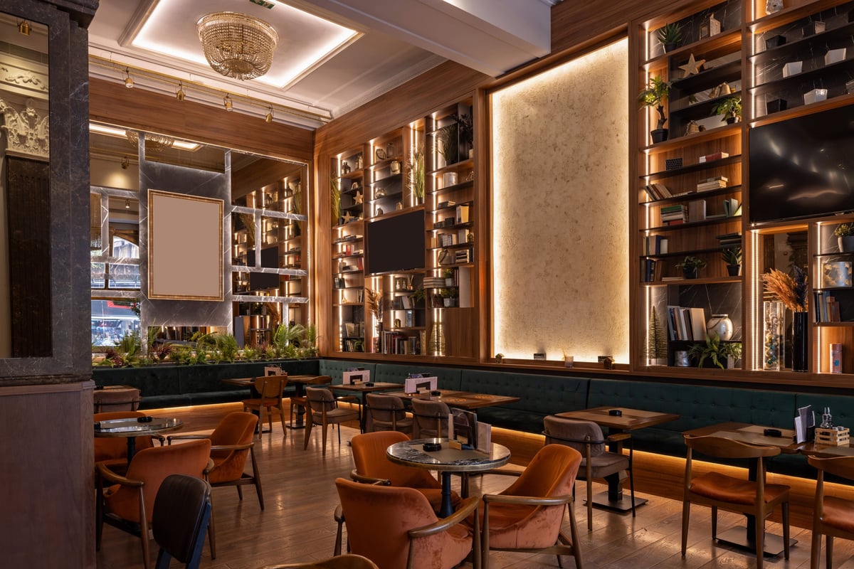 Stylish modern restaurant interior with warm lighting and wood detailing